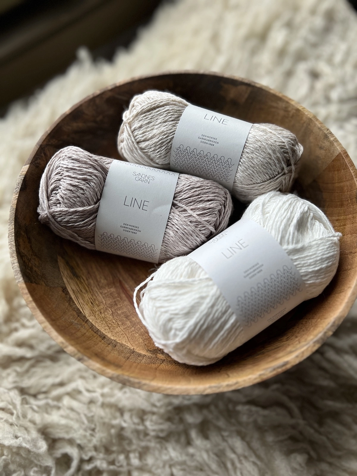 Sandnes Garn Line linen yarn in beige, white, kitt