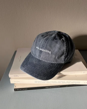 Knitters & Friends cap, never not knitting